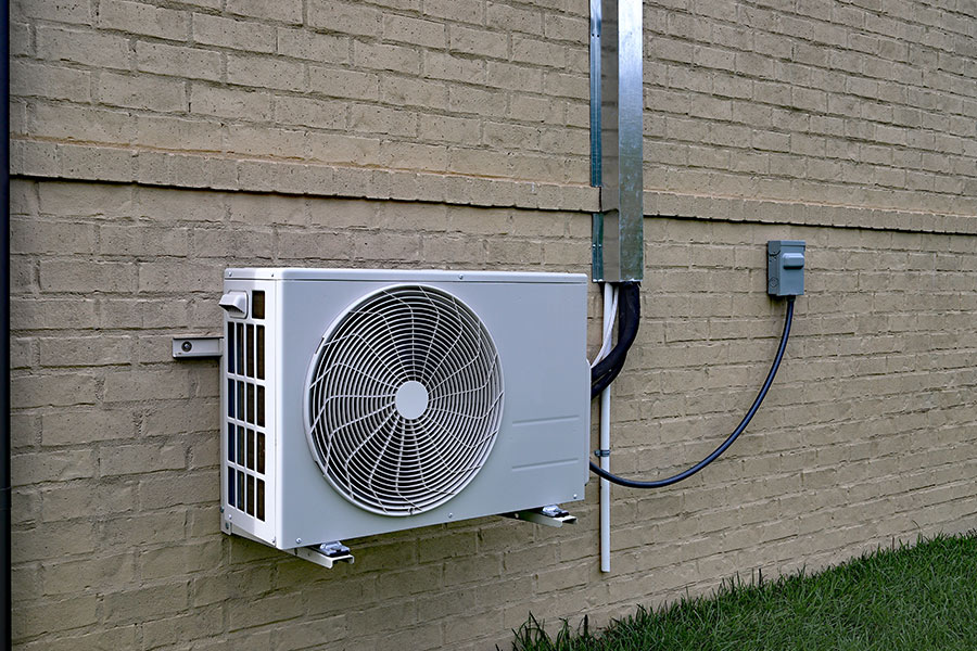 mini-split-air-conditioner-installd-at-house-exteriors-wall-montgomery-mn